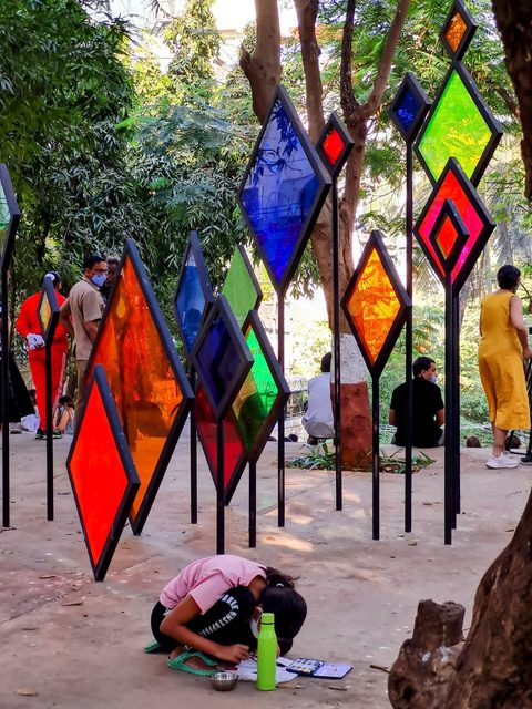 Coloured glass diamond installation among the trees